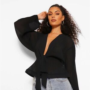 Woven puff sleeves with  peplum blouse. Size 12